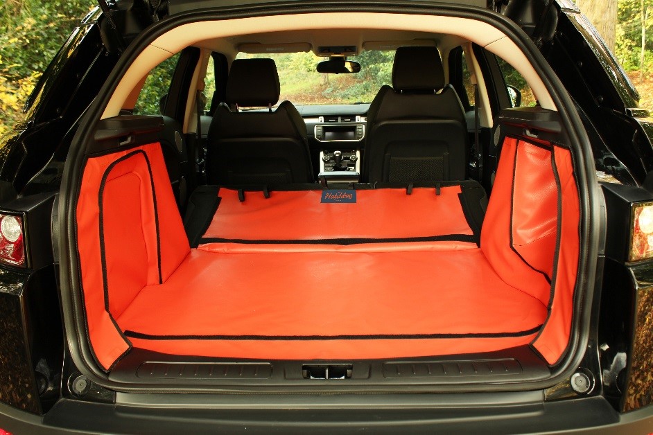 an orange boot liner with folded rear seats